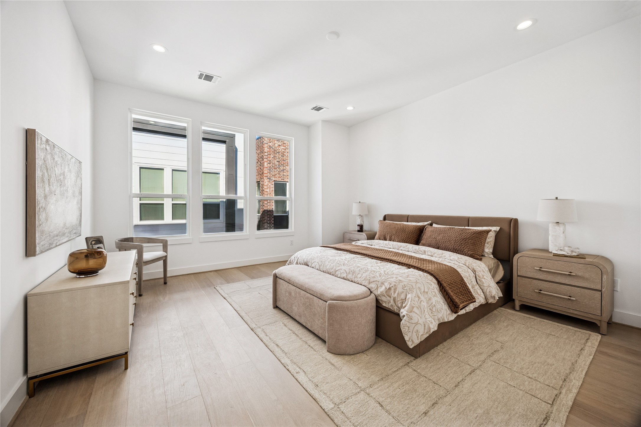 3008 Lamar Street Houston, TX 77003 - Photo 26 of 33 a spacious bedroom with a bed and a couch