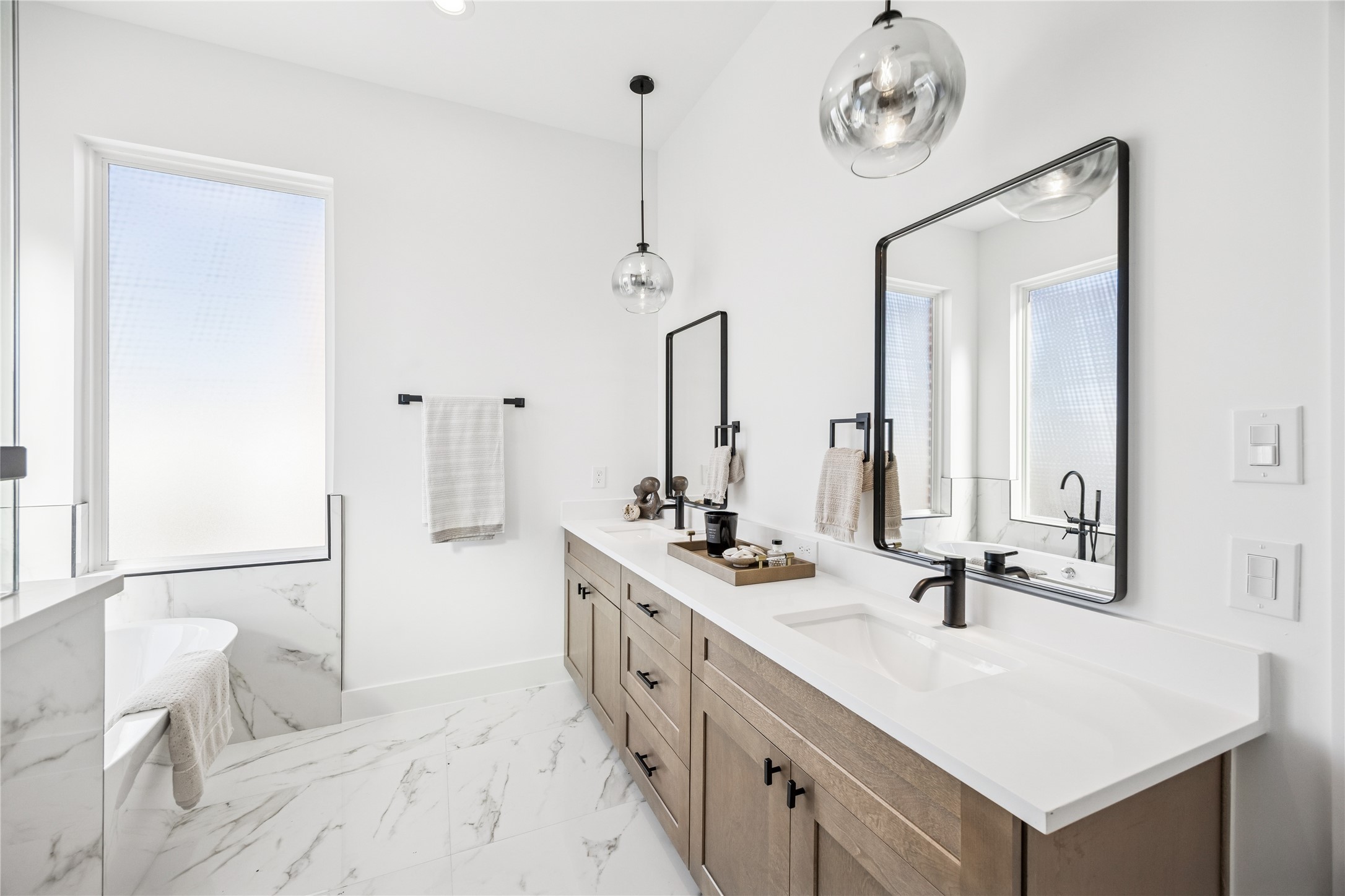 3008 Lamar Street Houston, TX 77003 - Photo 28 of 33 a spacious bathroom with a double vanity sink and a mirror