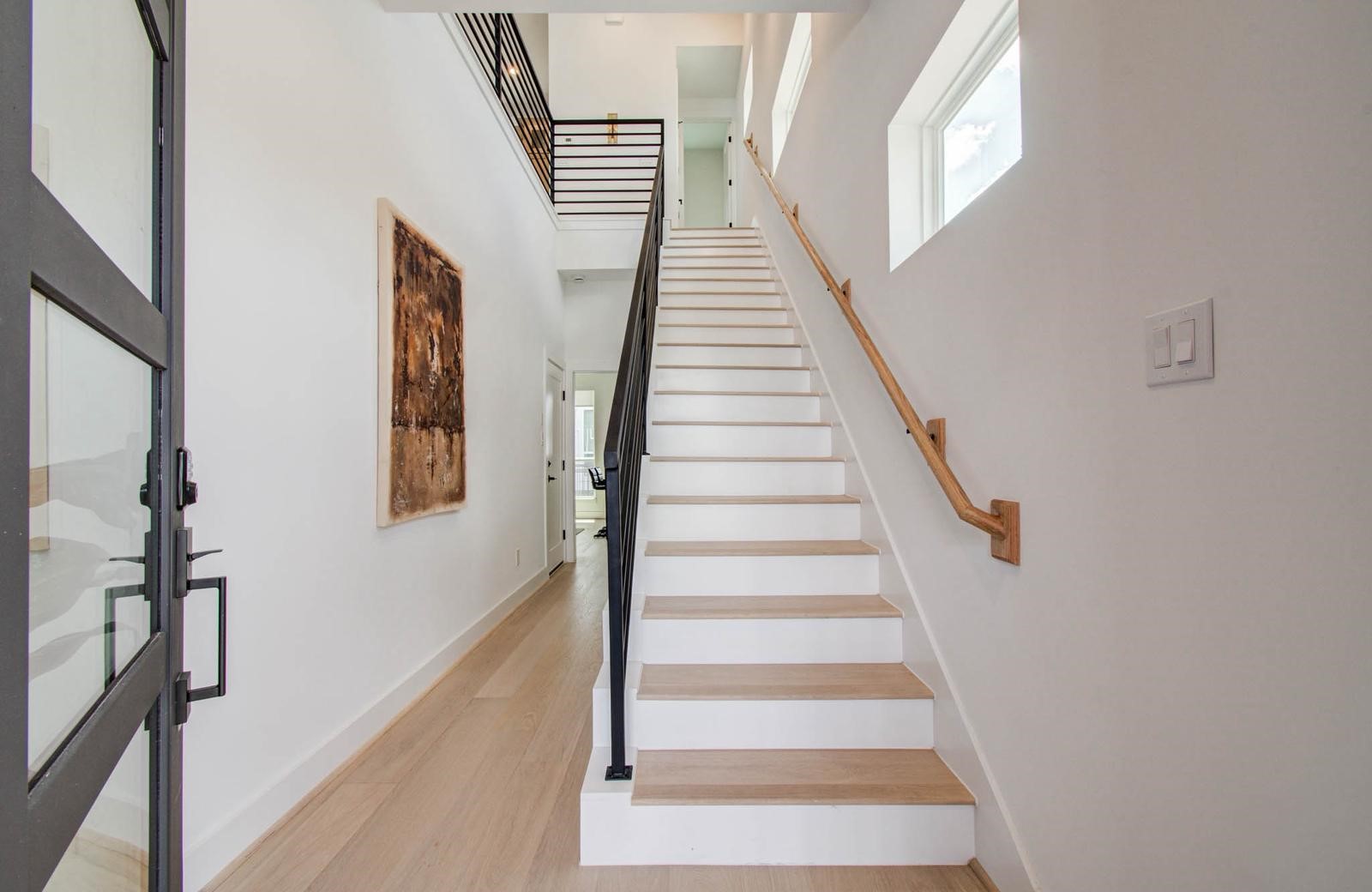 3008 Lamar Street Houston, TX 77003 - Photo 7 of 33 a view of staircase with white walls and windows