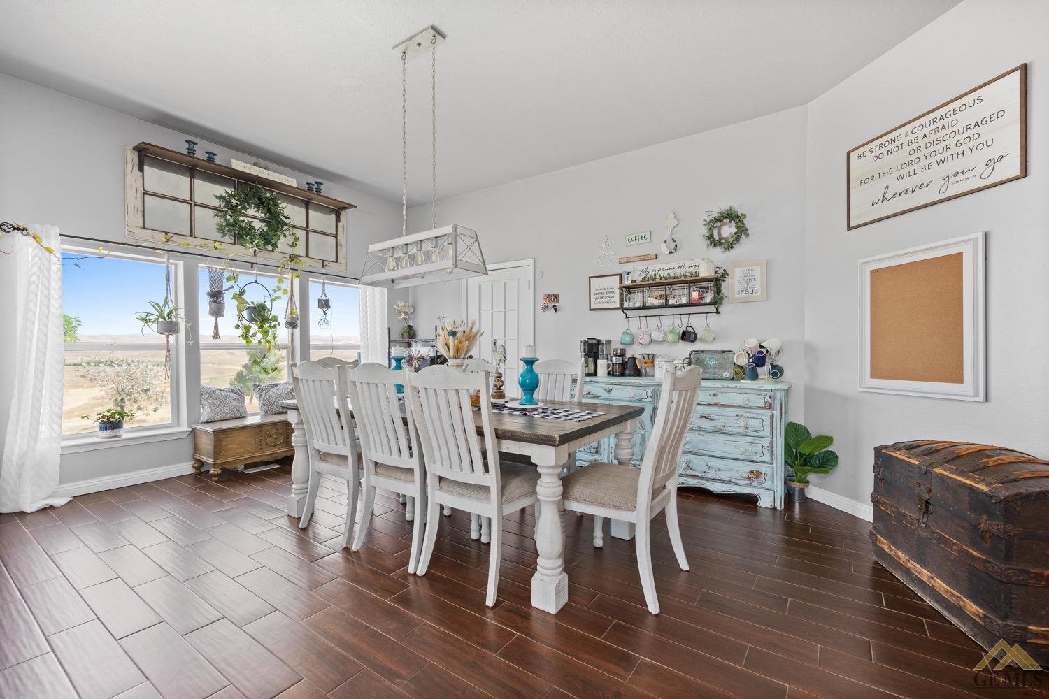 Undisclosed Address Bakersfield, CA 93308 - Photo 12 of 39 a view of a dining room with furniture window and wooden floor