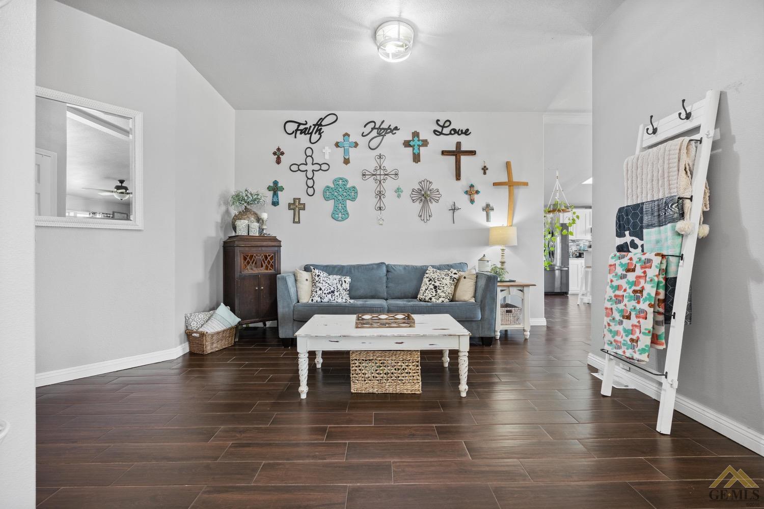 Undisclosed Address Bakersfield, CA 93308 - Photo 15 of 39 a living room with furniture and wooden floor