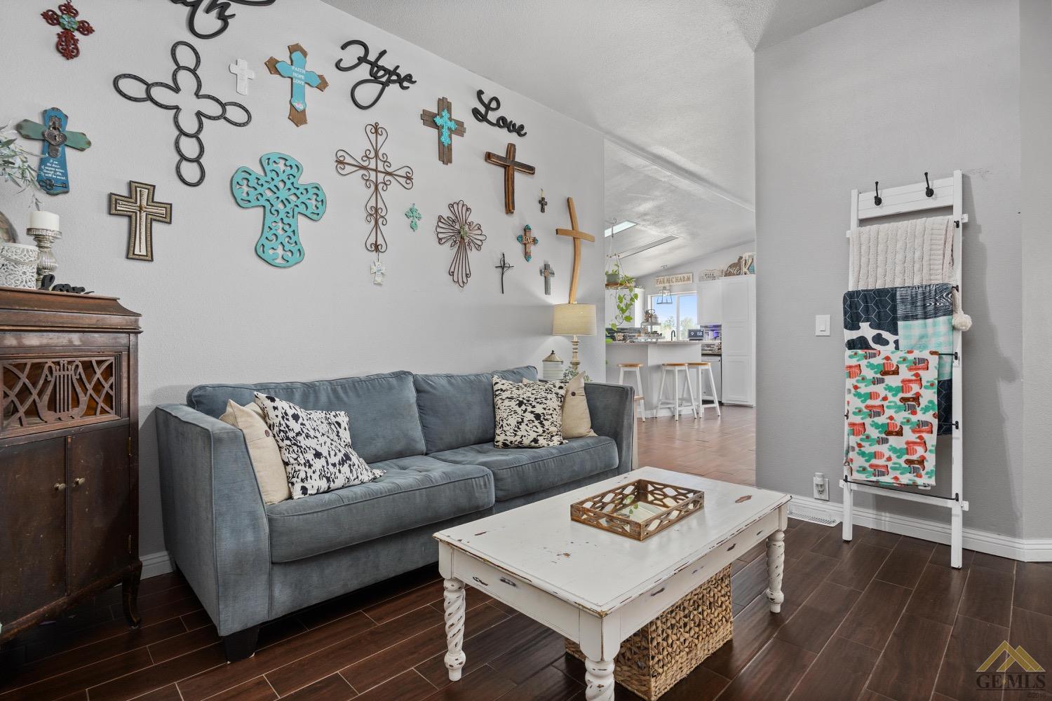 Undisclosed Address Bakersfield, CA 93308 - Photo 16 of 39 a living room with furniture and wooden floor