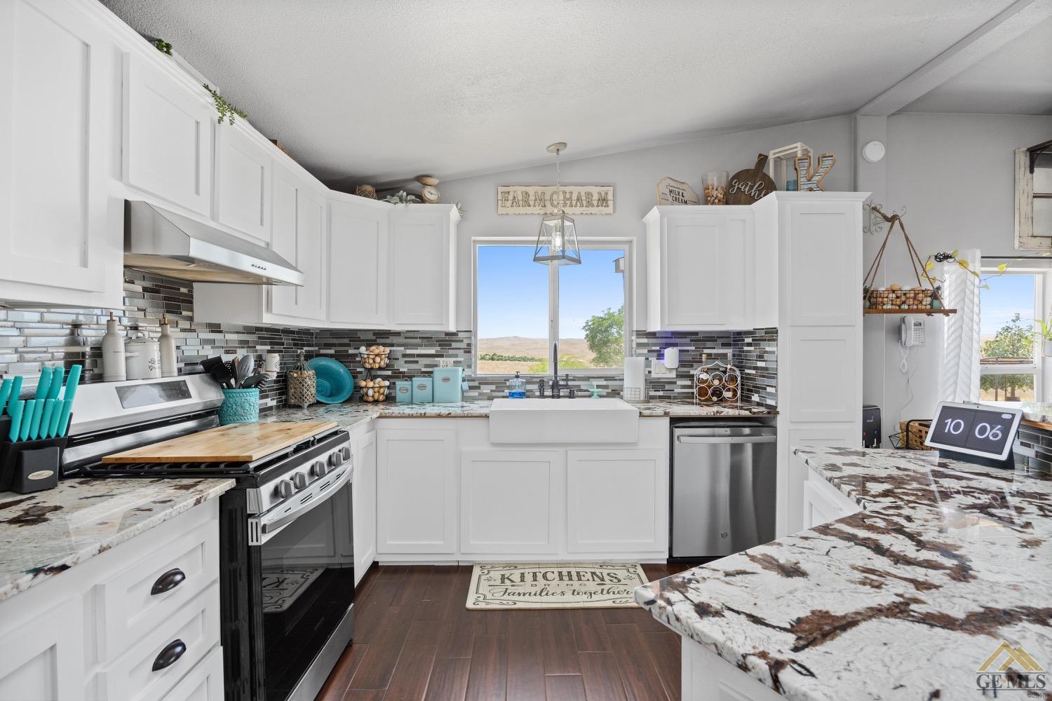 Undisclosed Address Bakersfield, CA 93308 - Photo 19 of 39 a kitchen with granite countertop a sink stove and refrigerator
