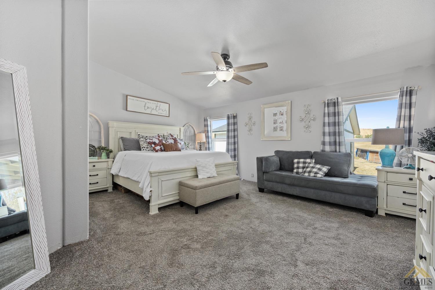 Undisclosed Address Bakersfield, CA 93308 - Photo 23 of 39 a bedroom with a bed and a couch