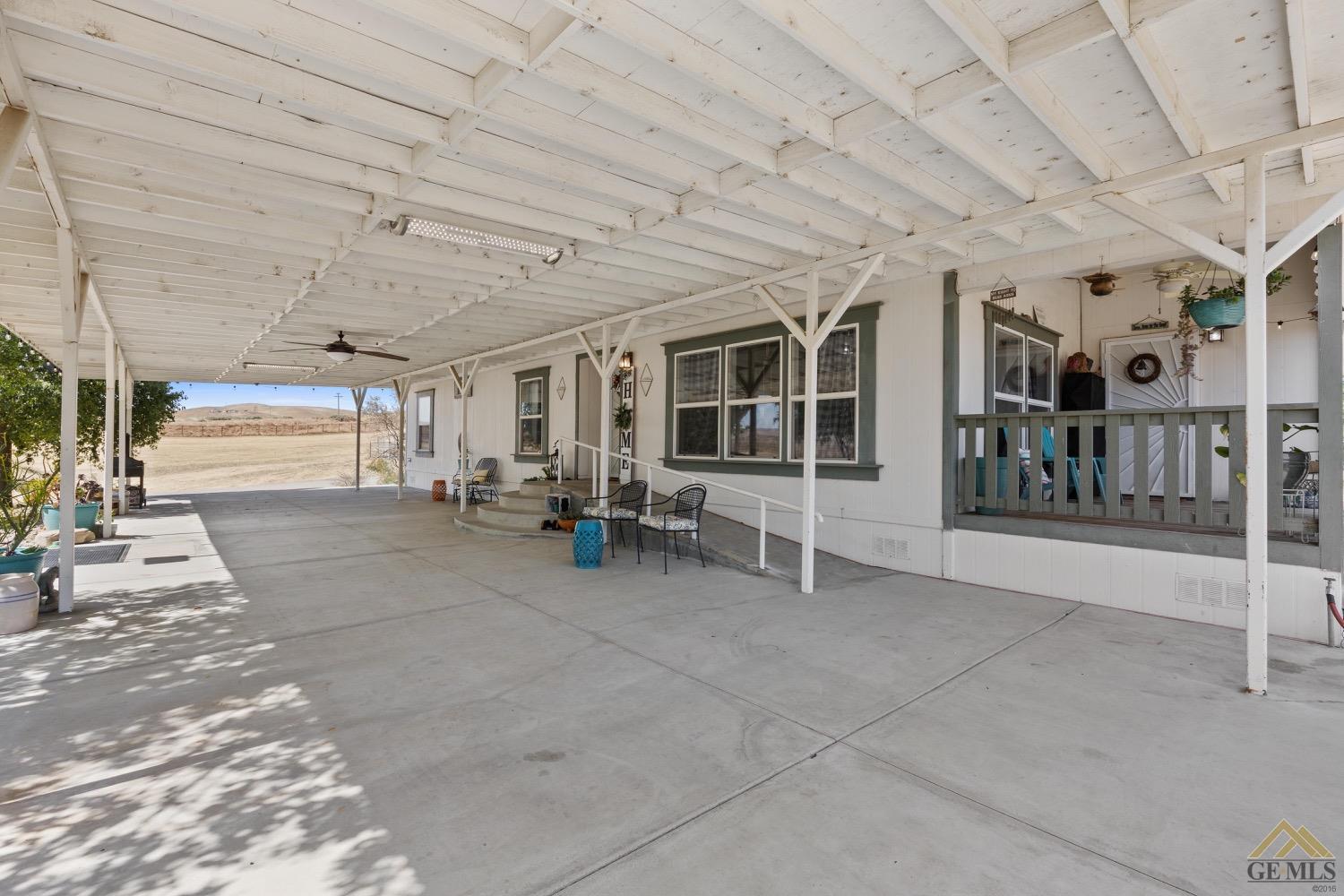 Undisclosed Address Bakersfield, CA 93308 - Photo 34 of 39 a view of a hall with wooden floors