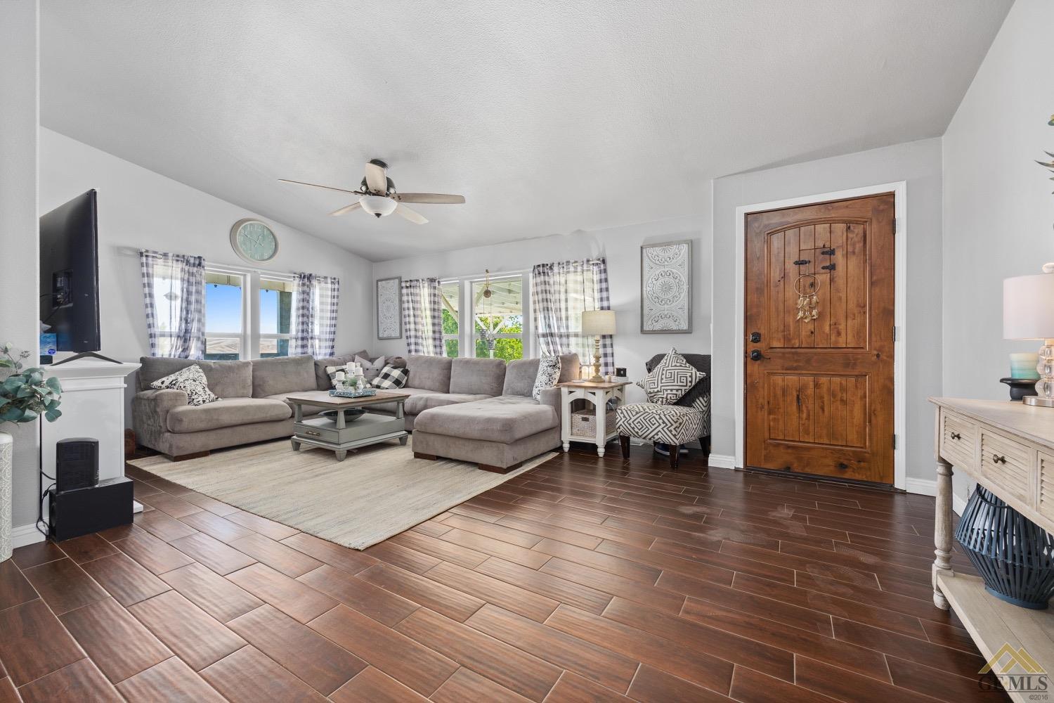 Undisclosed Address Bakersfield, CA 93308 - Photo 9 of 39 a living room with furniture and a fireplace