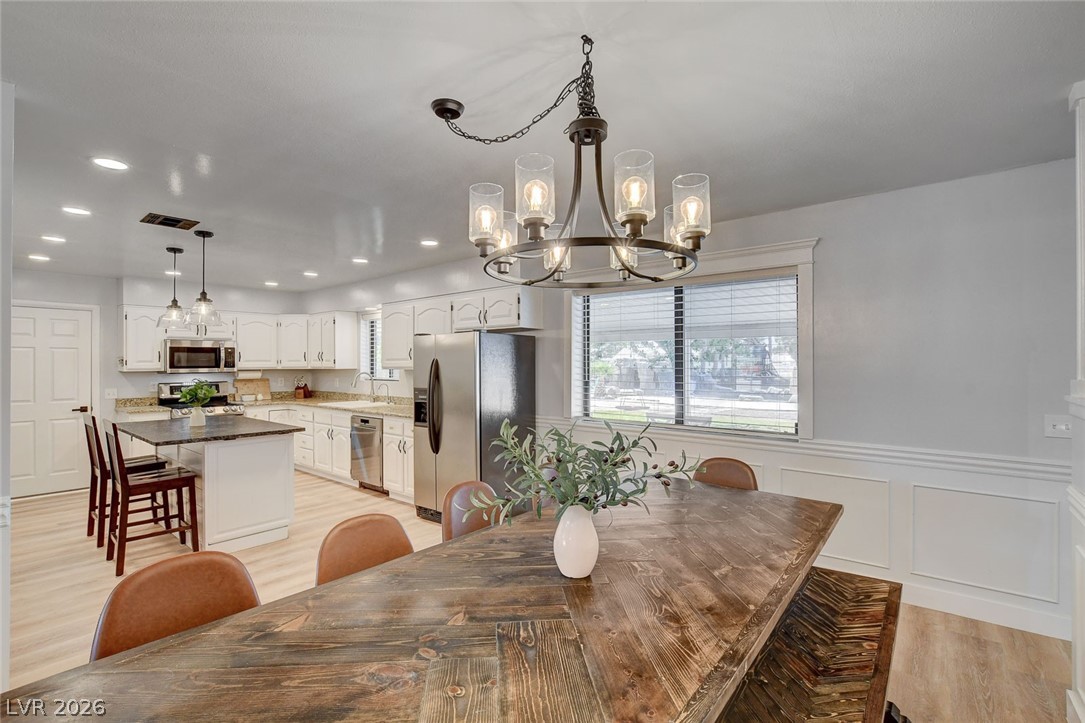 3765 Berkeley Street Logandale, NV 89021 - Photo 23 of 87 This spacious kitchen and dining area features abundant natural light and modern amenities.