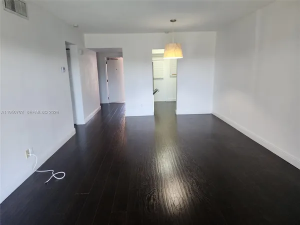 a view of a livingroom with wooden floor