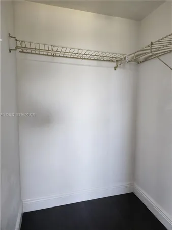 a view of a room with racks on the wall