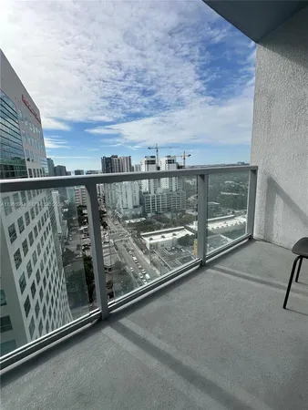 a view of a balcony with city view