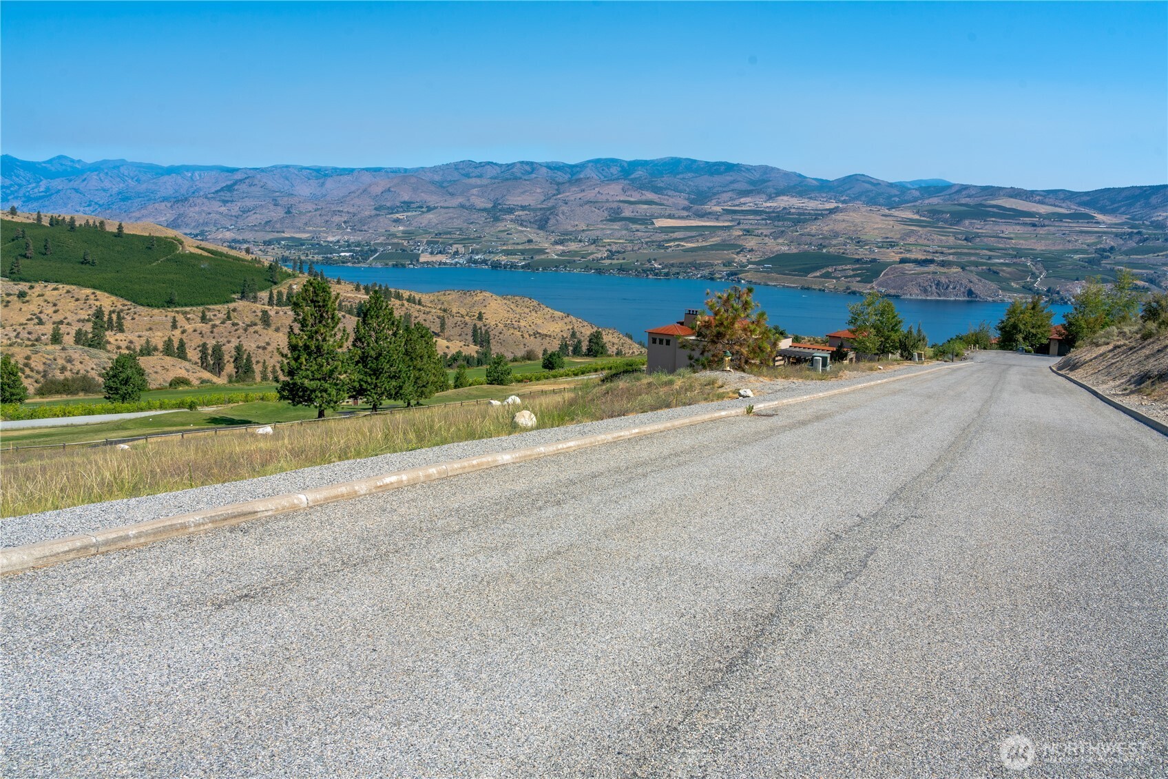 322 Paintbrush Road Chelan, WA 98816 - Photo 15 of 26 a view of a road with mountains in the background