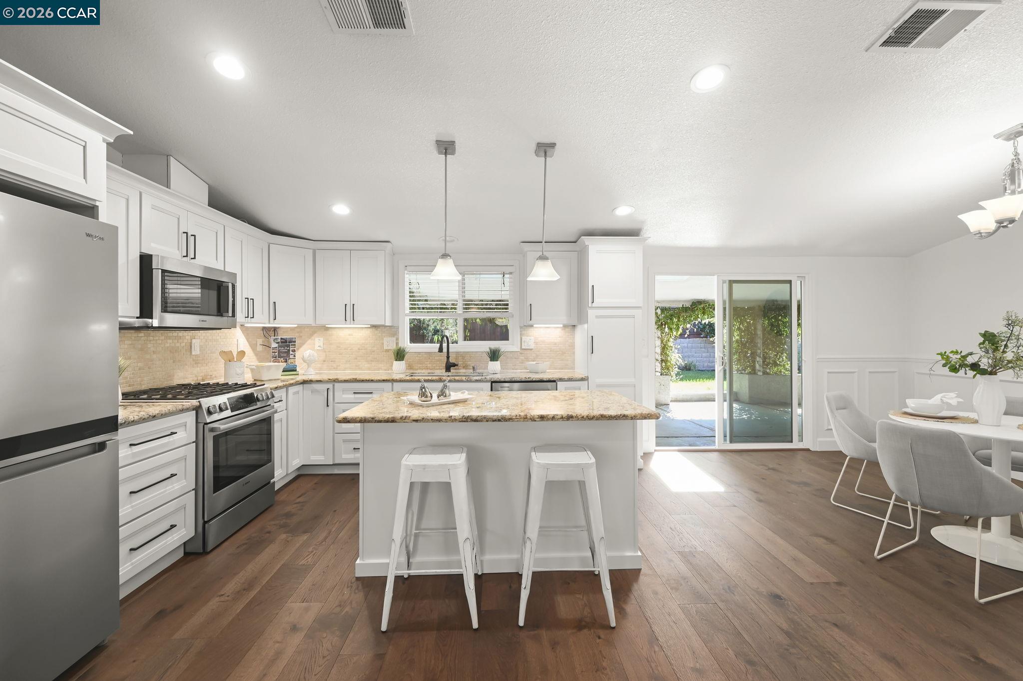 3782 Hitchcock Road Concord, CA 94518 - Photo 8 of 30 Living room flows seamlessly to kitchen complete with refreshed cabinets, plenty of lighting and all appliances
