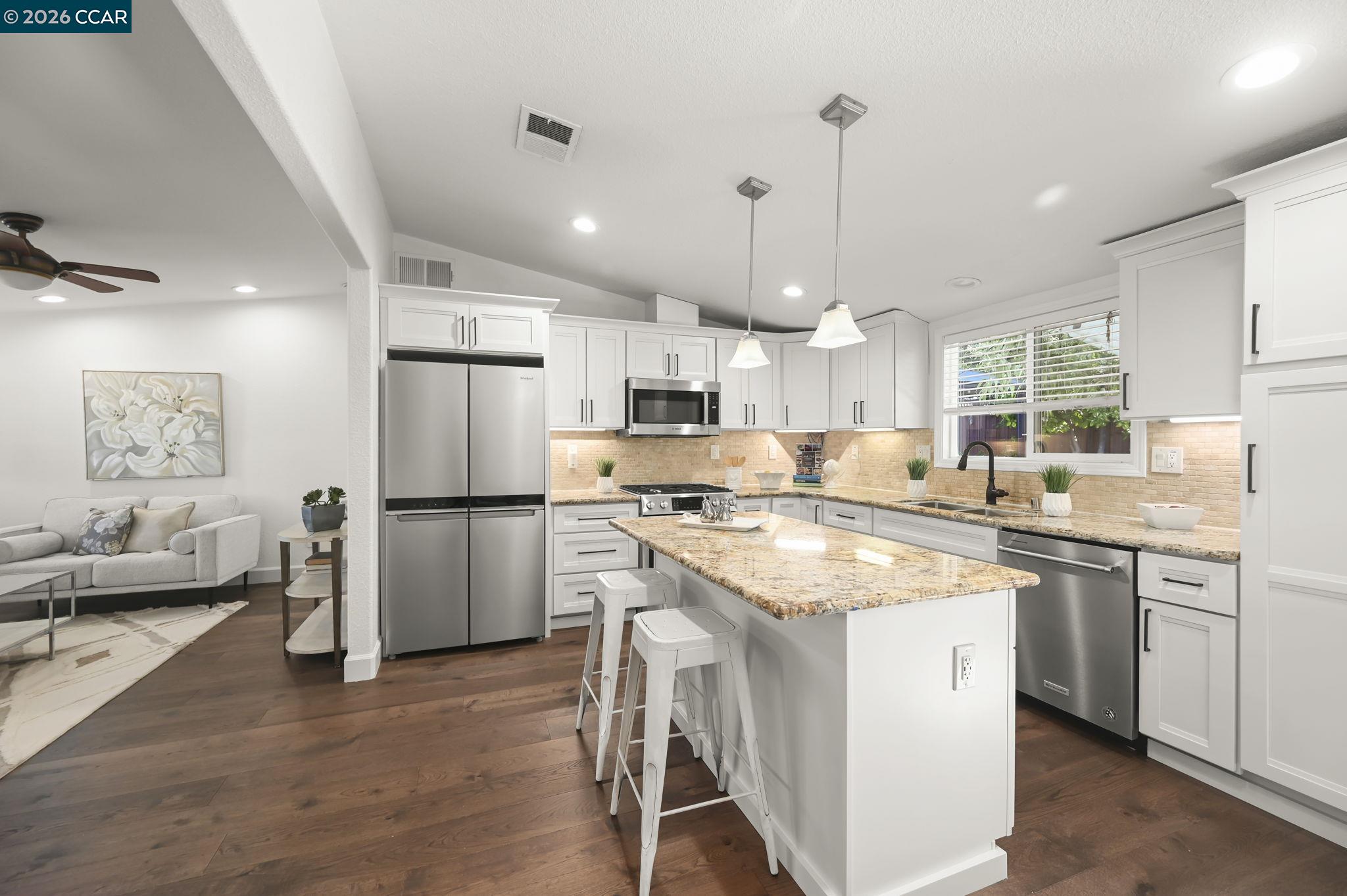 3782 Hitchcock Road Concord, CA 94518 - Photo 9 of 30 Looking from dining room to kitchen - stainless appliances, pendant lighting, gas range