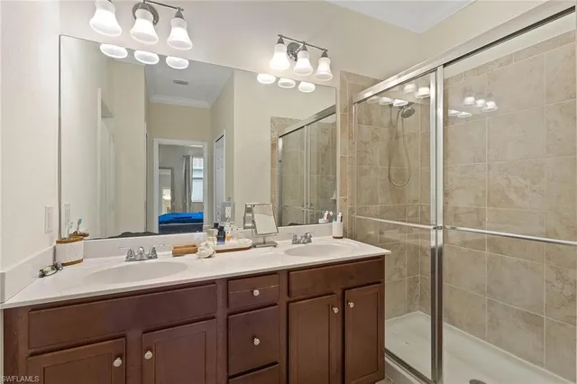 a bathroom with a double vanity sink mirror and double