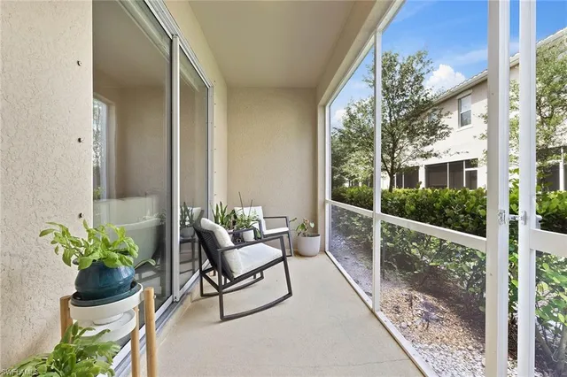 a view of a balcony with chairs