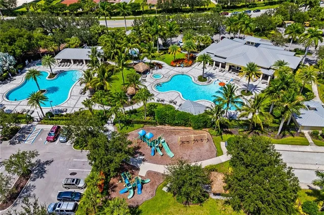 an aerial view of residential house with outdoor space and swimming pool