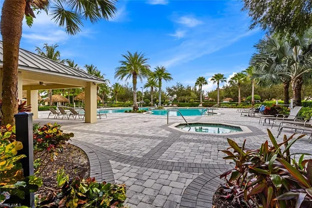 a view of a swimming pool with a table and chairs