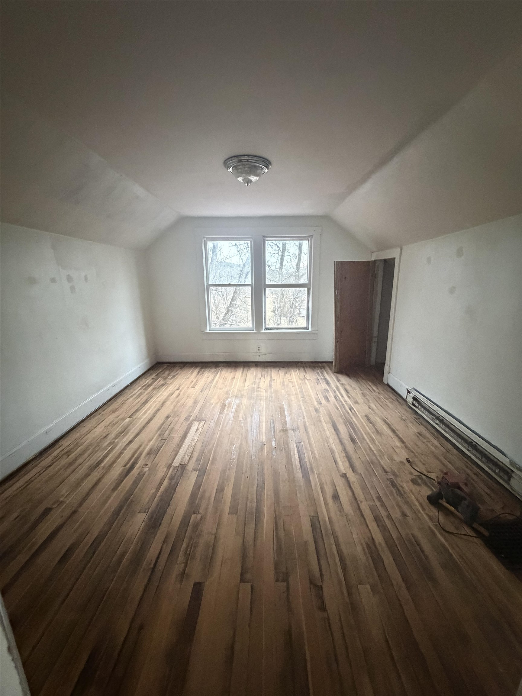 39 Church Hl Road Goshen, VA 24439 - Photo 11 of 27 wooden floor in an empty room with a window