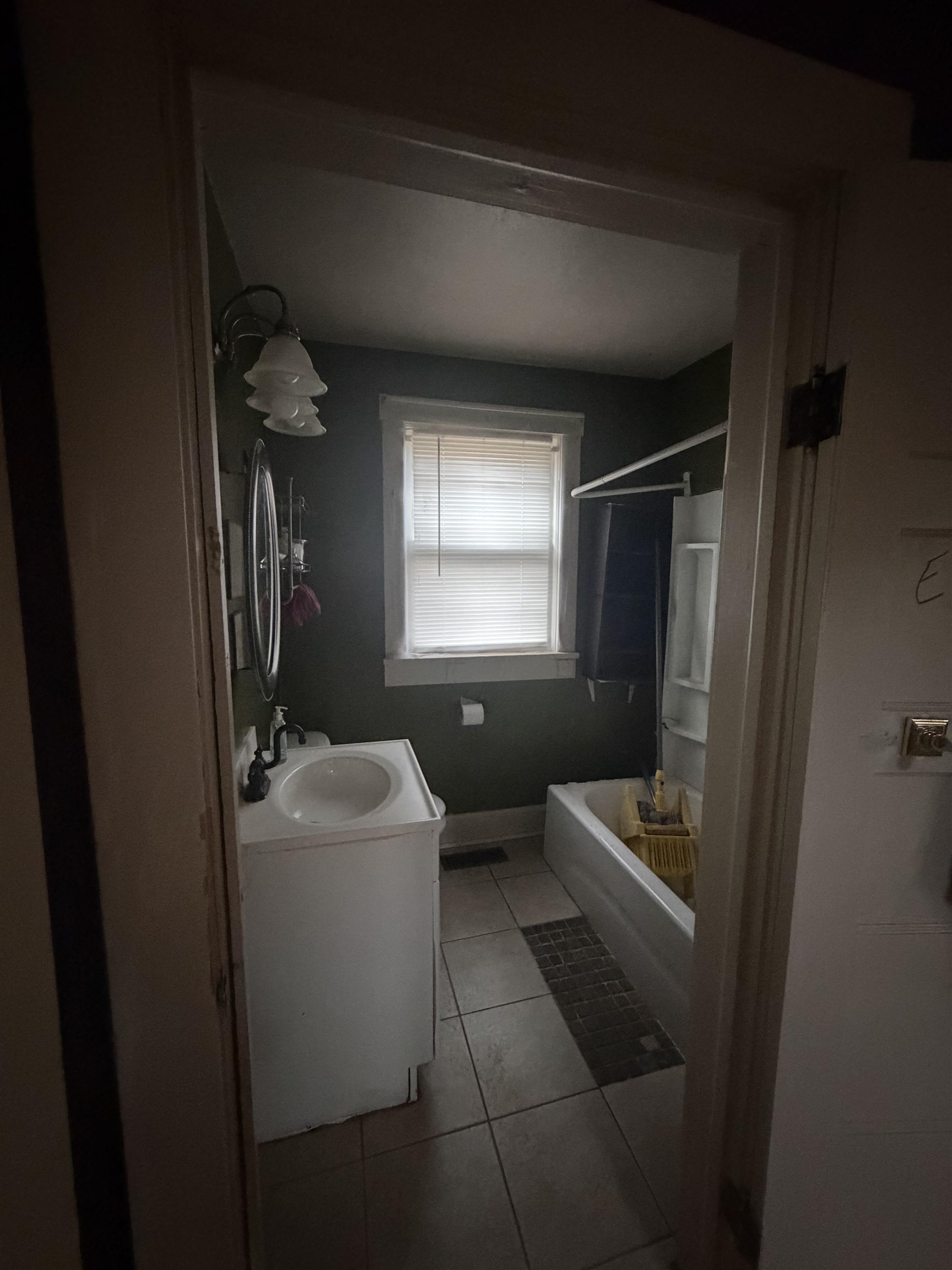 39 Church Hl Road Goshen, VA 24439 - Photo 15 of 27 a bathroom with a sink toilet vanity and window