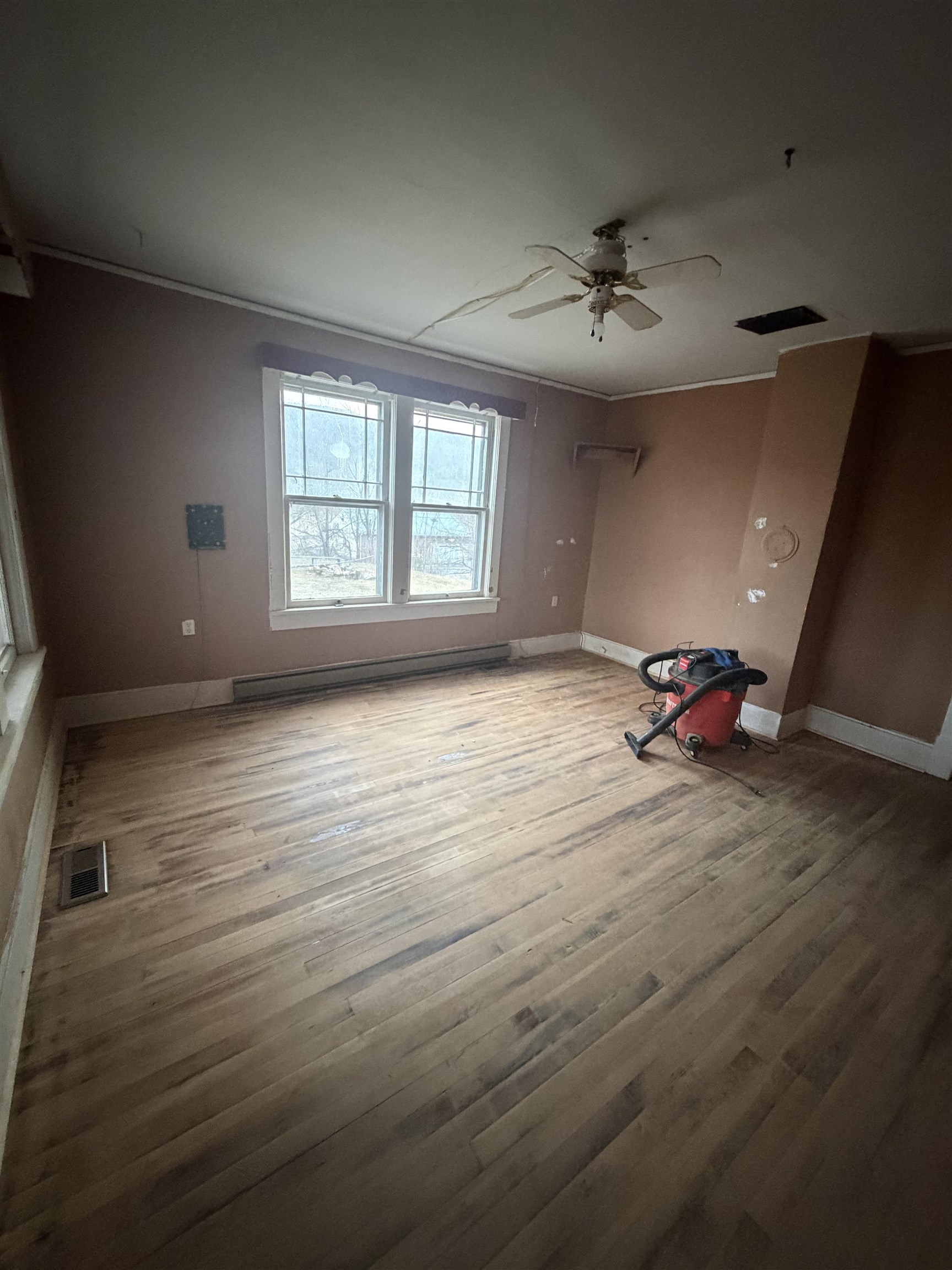 39 Church Hl Road Goshen, VA 24439 - Photo 16 of 27 wooden floor in an empty room with a window