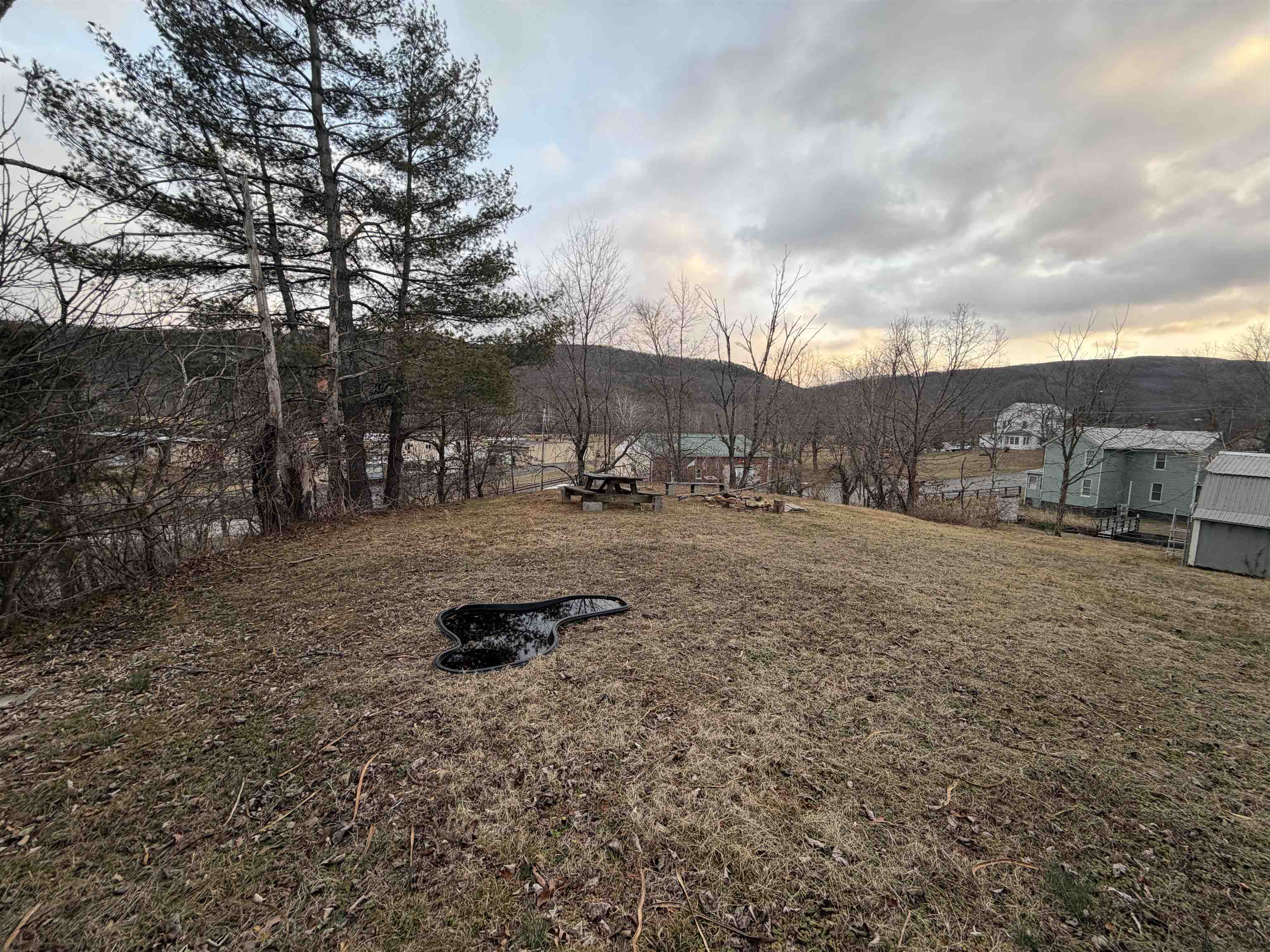 39 Church Hl Road Goshen, VA 24439 - Photo 20 of 27 a backyard of a house with table and chairs