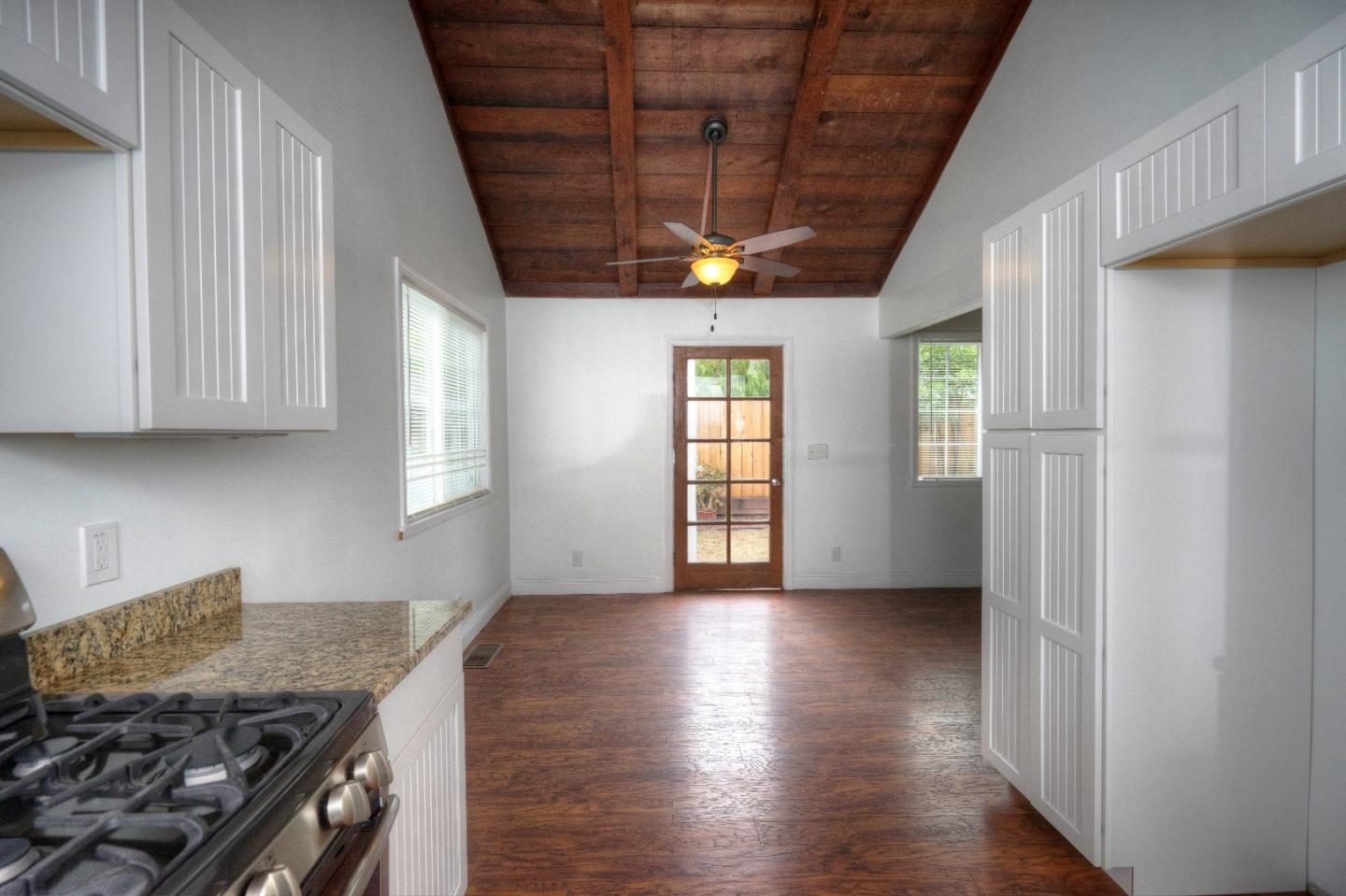197 Ramona Avenue Pacifica, CA 94044 - Photo 12 of 26 a kitchen with granite countertop a stove and a refrigerator