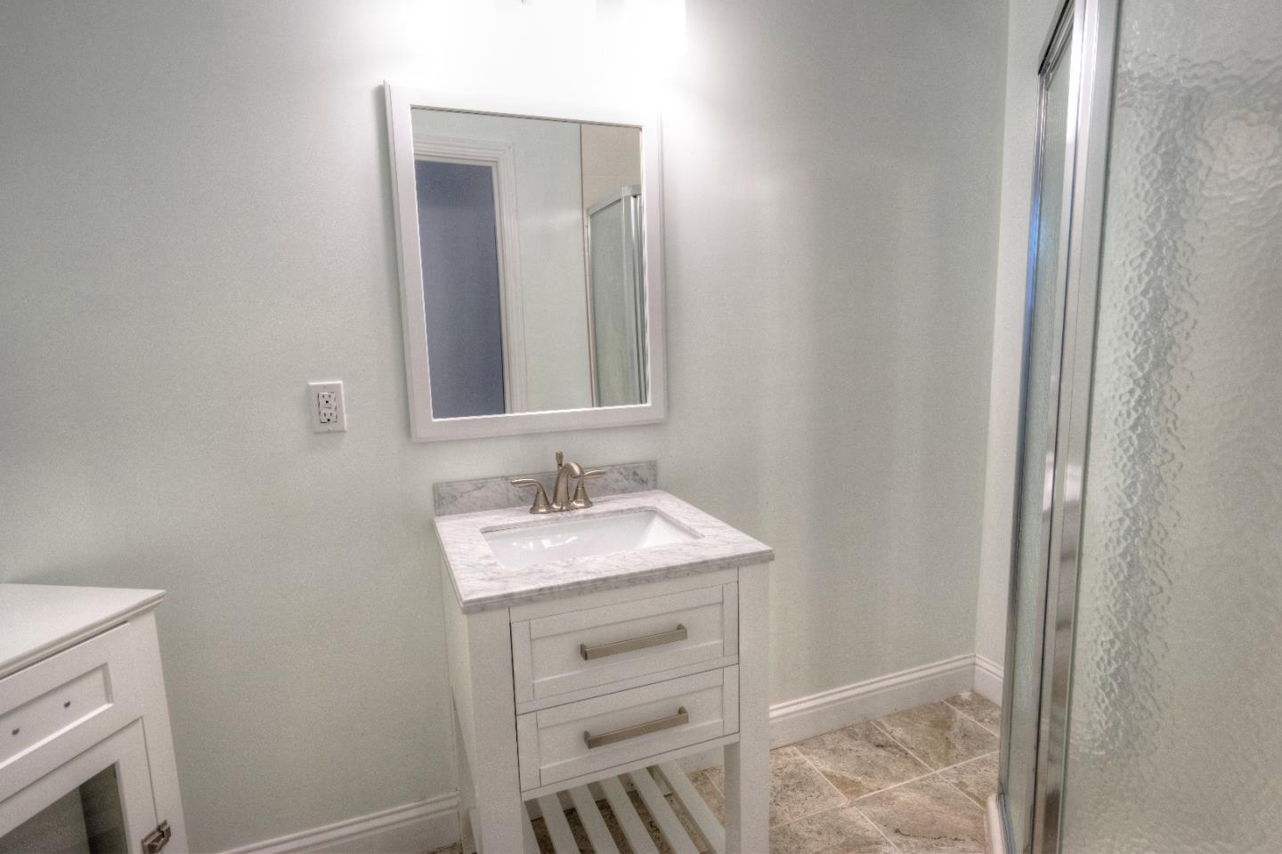197 Ramona Avenue Pacifica, CA 94044 - Photo 15 of 26 a bathroom with a sink and a mirror
