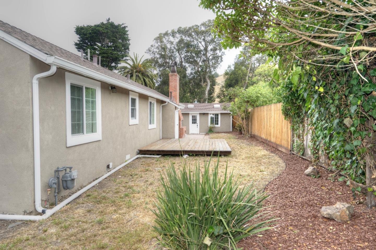 197 Ramona Avenue Pacifica, CA 94044 - Photo 21 of 26 a view of a house with backyard and sitting area