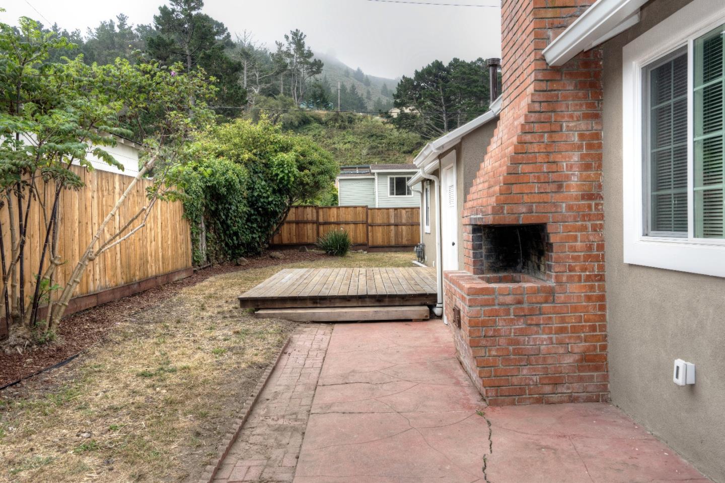 197 Ramona Avenue Pacifica, CA 94044 - Photo 23 of 26 a front view of a house with a yard