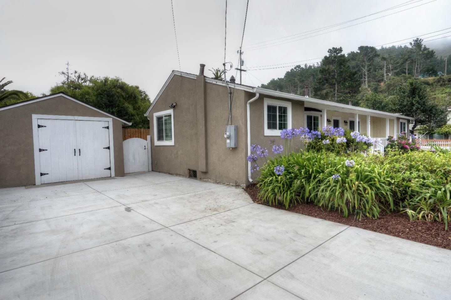 197 Ramona Avenue Pacifica, CA 94044 - Photo 24 of 26 a front view of house with yard and trees around