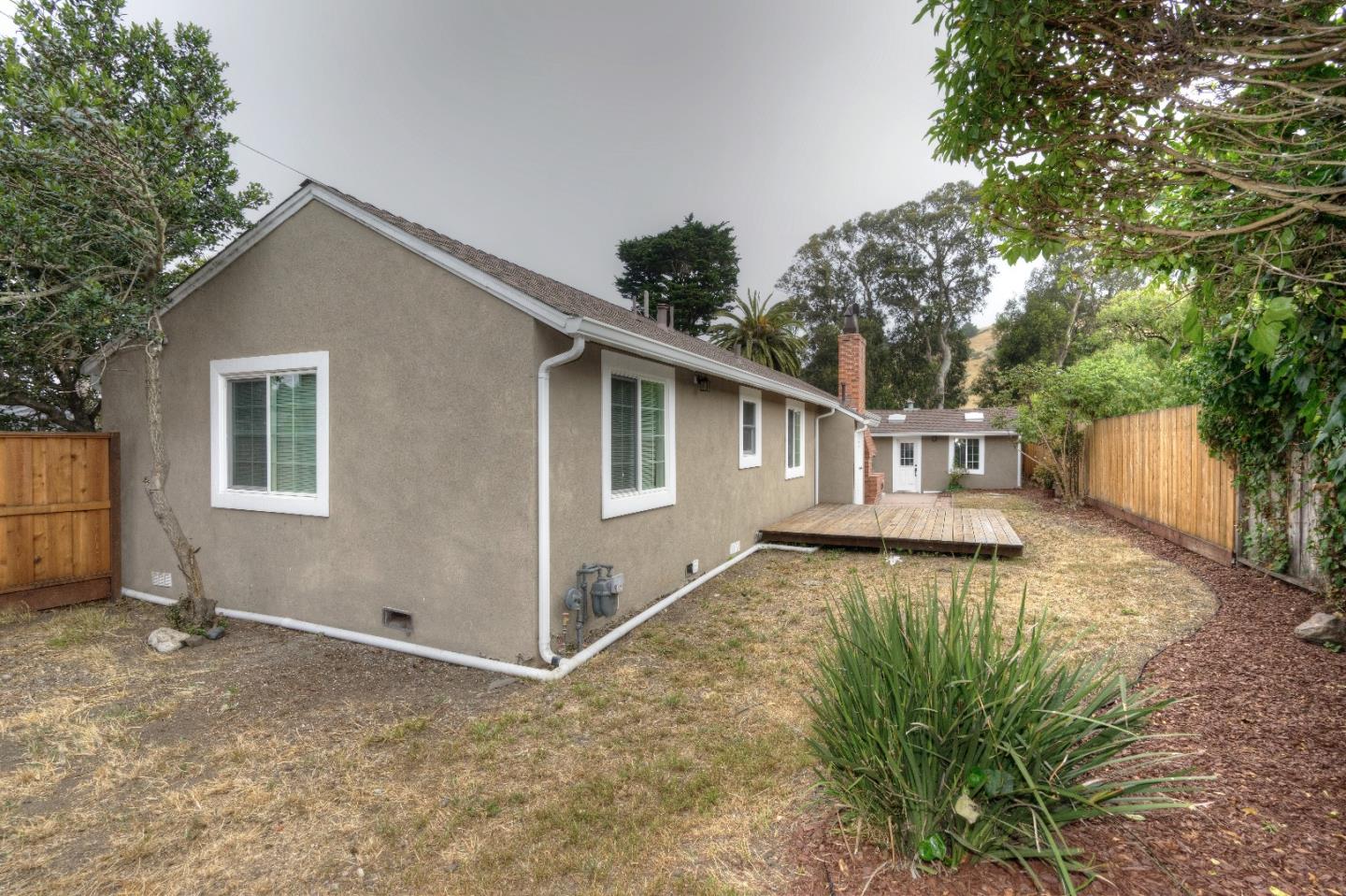 197 Ramona Avenue Pacifica, CA 94044 - Photo 3 of 26 a view of a house with backyard and sitting area