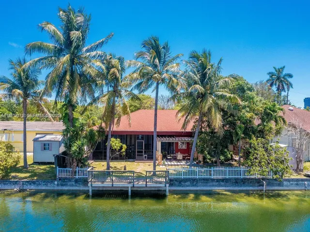 a house with swimming pool in front of it