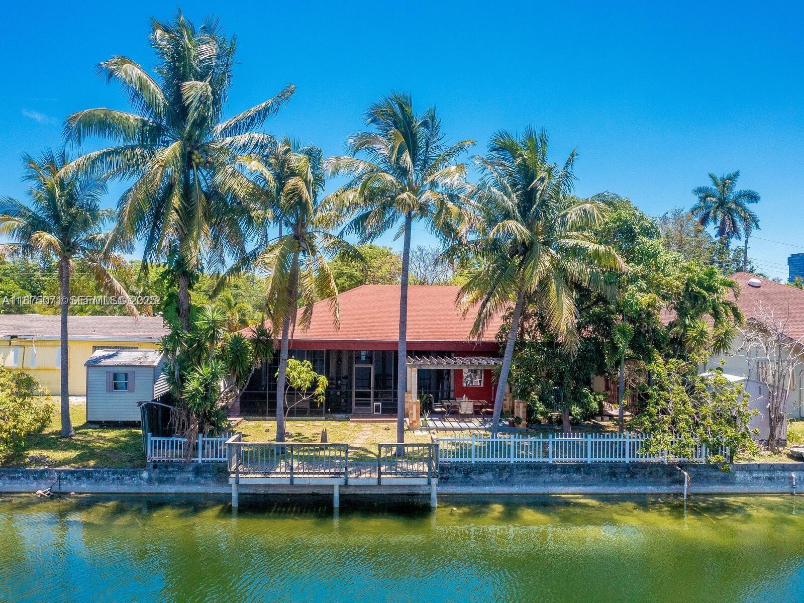 a house with swimming pool in front of it