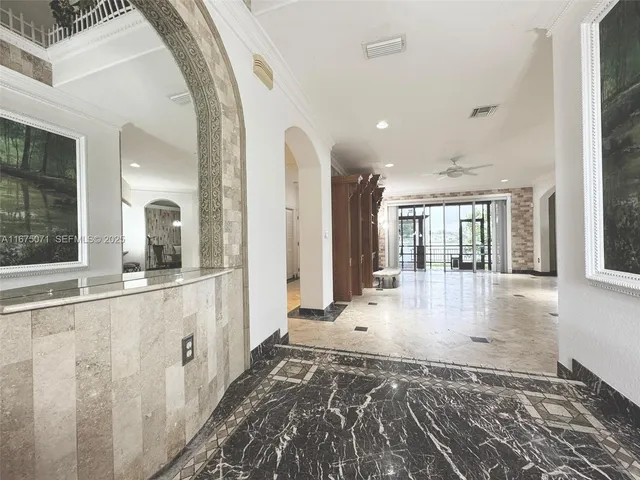 a view of a room with wooden floor and windows