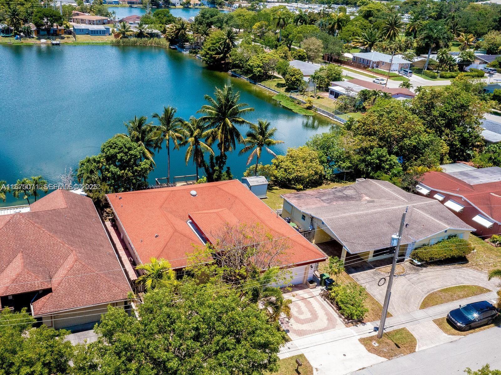 232 Southwest 7th Avenue Hallandale Beach, FL 33009 - Photo 3 of 48 an aerial view of a house with outdoor space and lake view