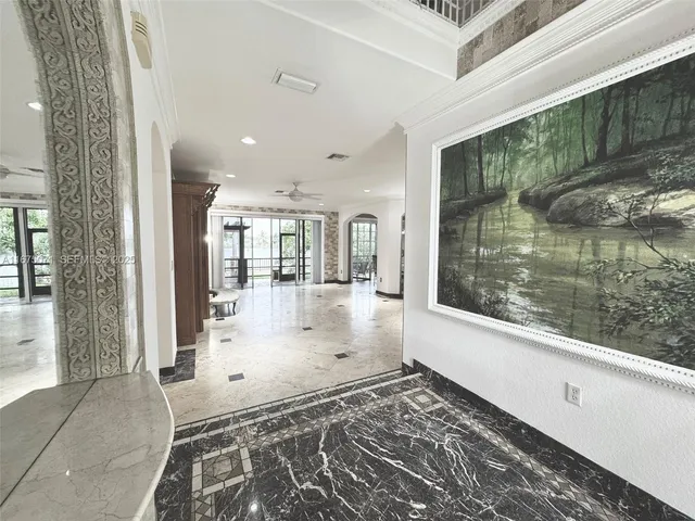 a view of a living room and a balcony