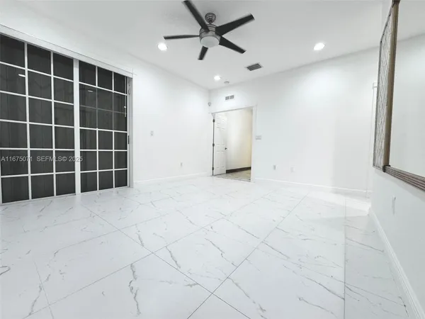 a view of empty room with windows