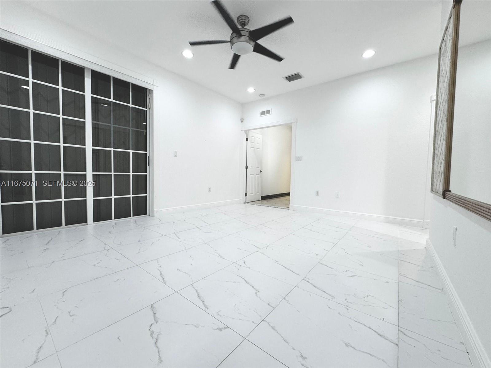 232 Southwest 7th Avenue Hallandale Beach, FL 33009 - Photo 43 of 48 a view of empty room with windows