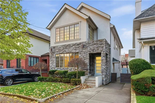 a front view of a house with garden