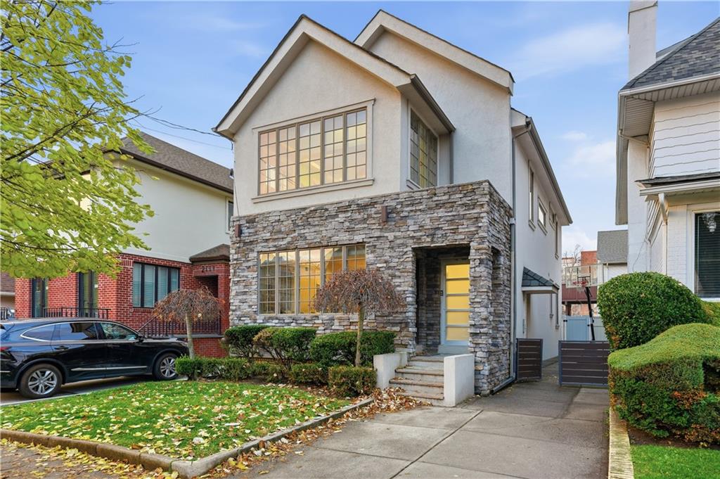 a front view of a house with garden