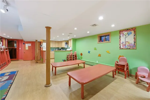 a living room with furniture a table and potted plants