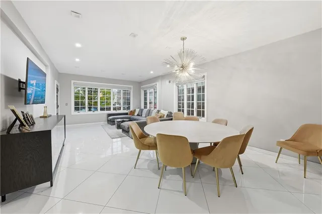 a view of a dining room with furniture and a livingroom