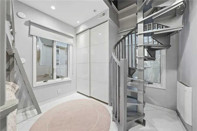 a bed room with a bed and a window