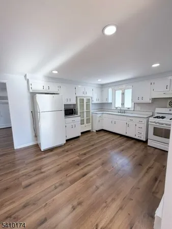 a view of kitchen with wooden floor