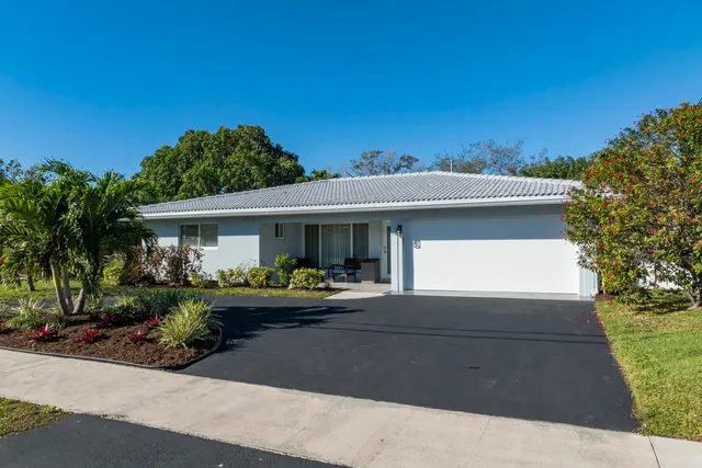 a front view of a house with yard