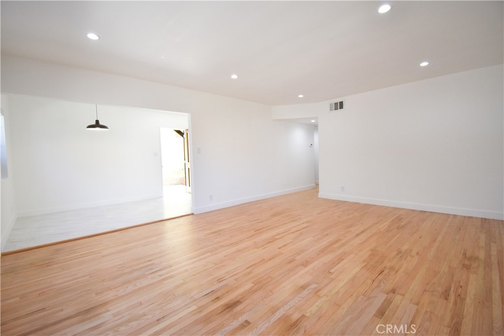 1570 North Verdugo Road, Unit B Glendale, CA 91208 - Photo 8 of 12 wooden floor in an empty room with a window
