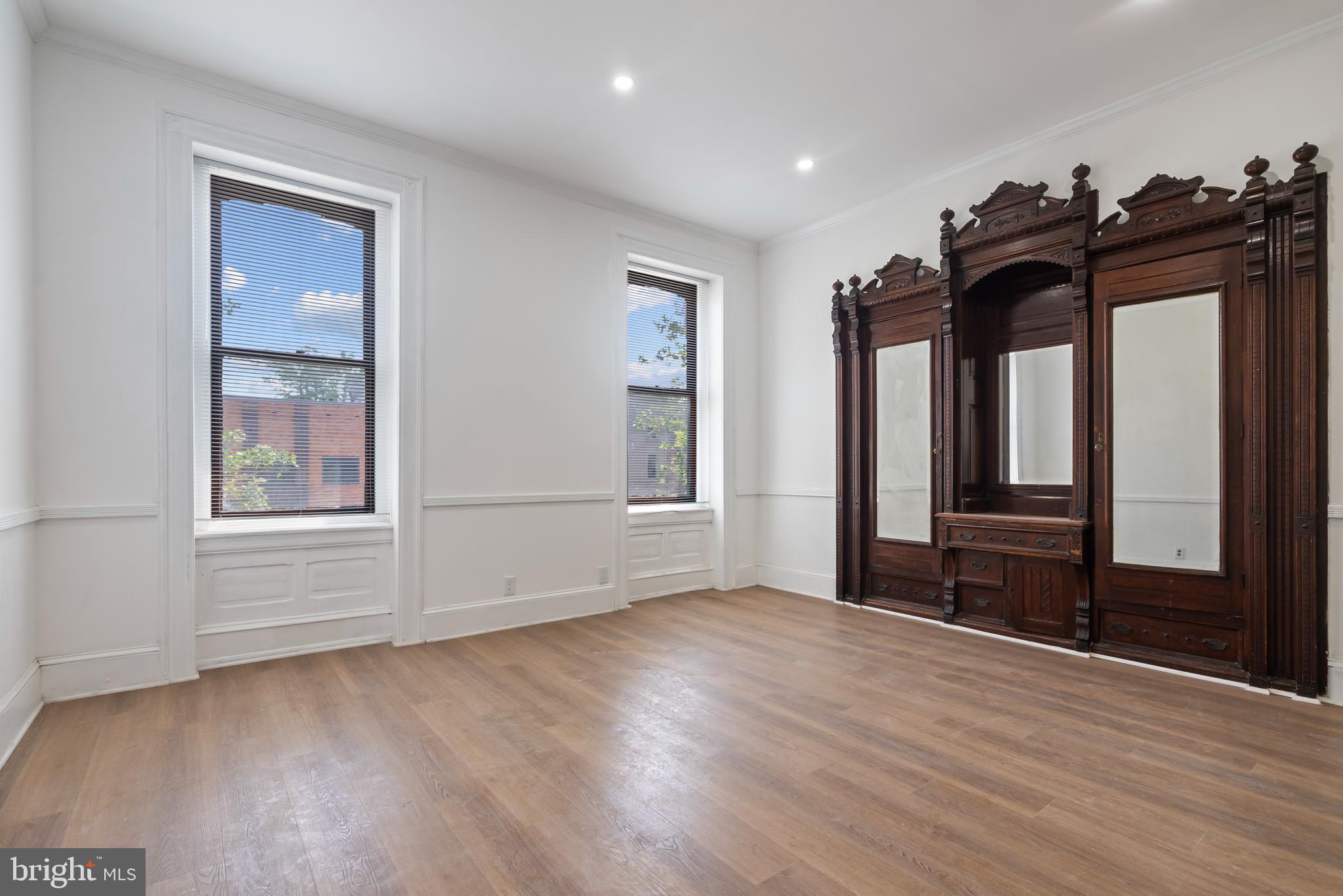 1618 South Broad Street Philadelphia, PA 19145 - Photo 11 of 27 a view of empty room with wooden floor and fan