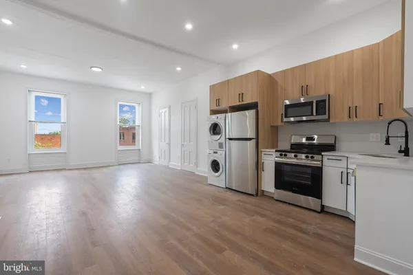 a view of a kitchen with washer and dryer