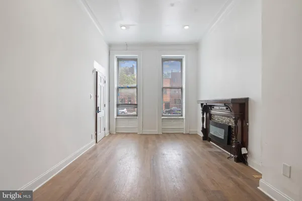 a kitchen with a refrigerator and a stove top oven
