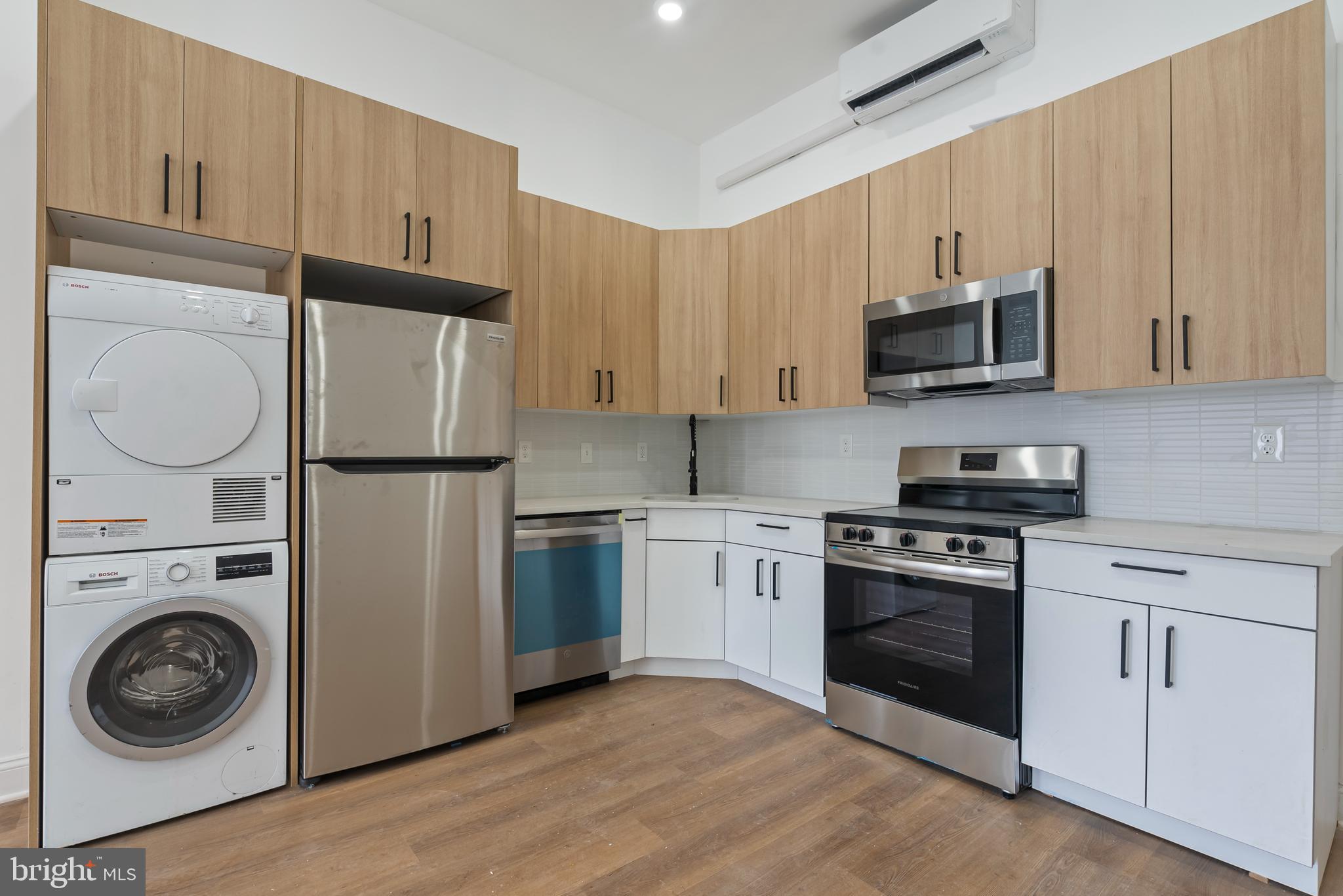 1618 South Broad Street Philadelphia, PA 19145 - Photo 4 of 27 a kitchen with a refrigerator and a stove top oven